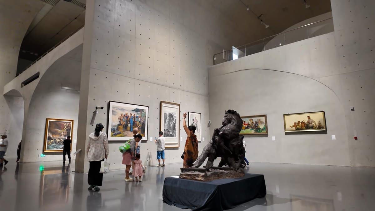 Vaulted concrete hall with paintings