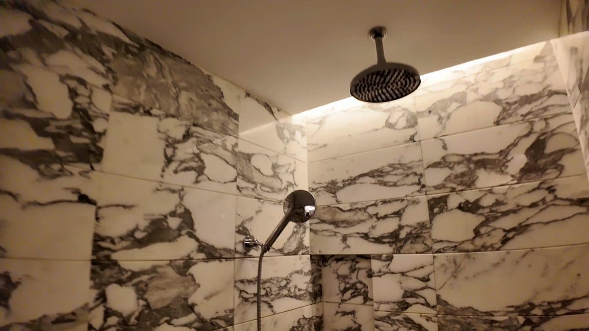 Veined marble walk-in shower