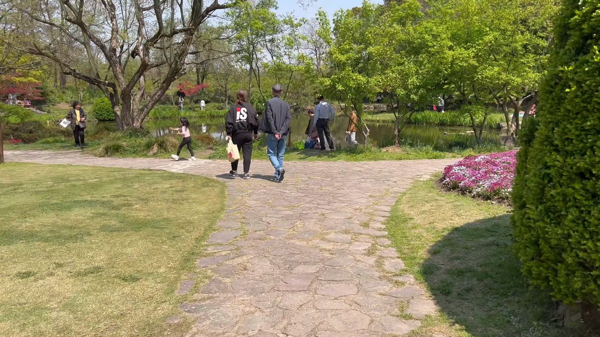 Visitors on stone garden path