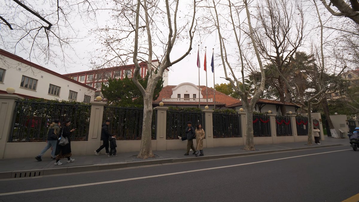 Walled compound behind iron railings