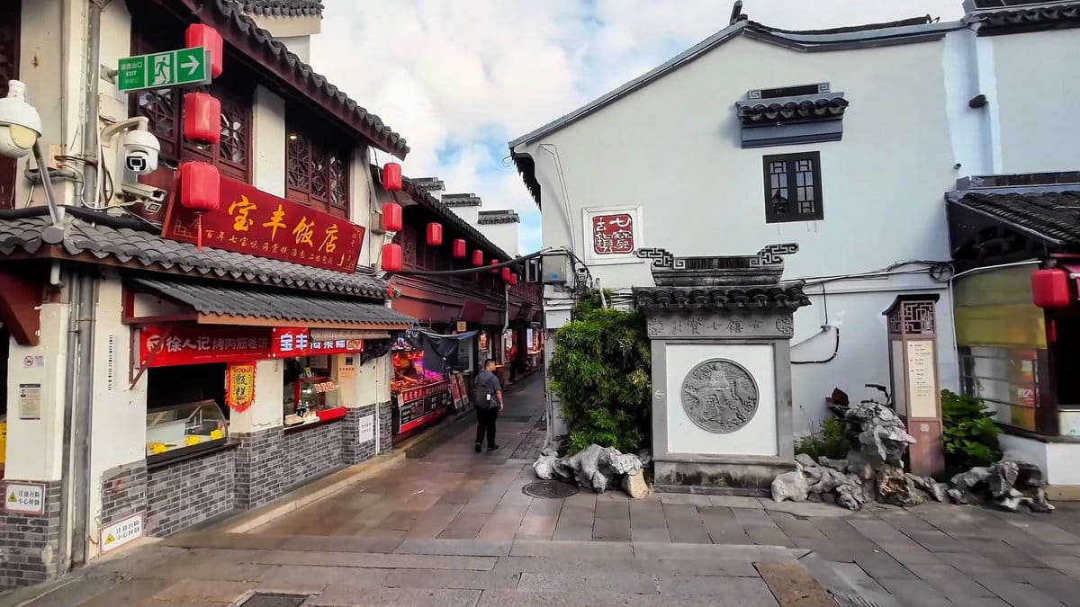 White walls and black-tiled rooftops