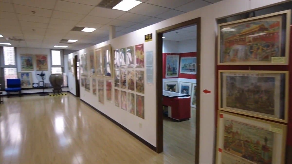 Wide view of poster-lined gallery