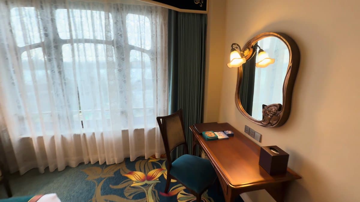 Writing desk under gilt mirror