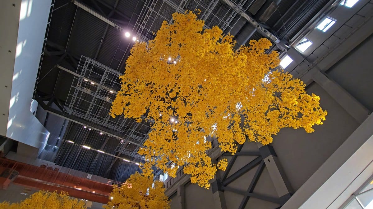 Yellow foliage against industrial roof