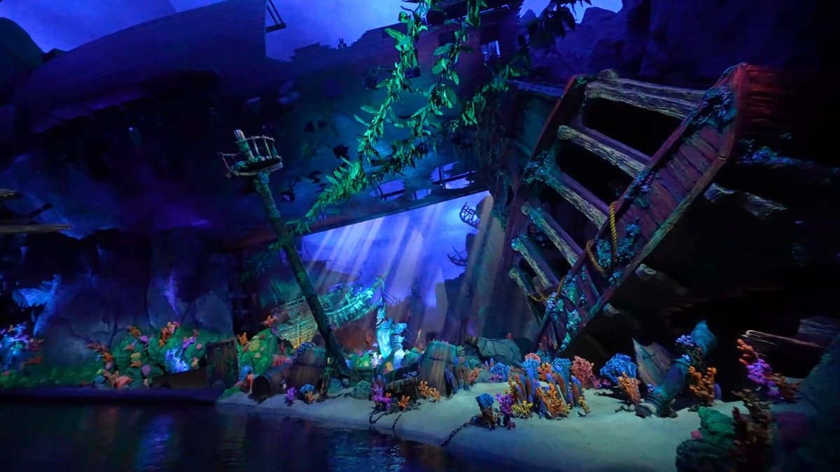 A lit underwater set with a wrecked ship
