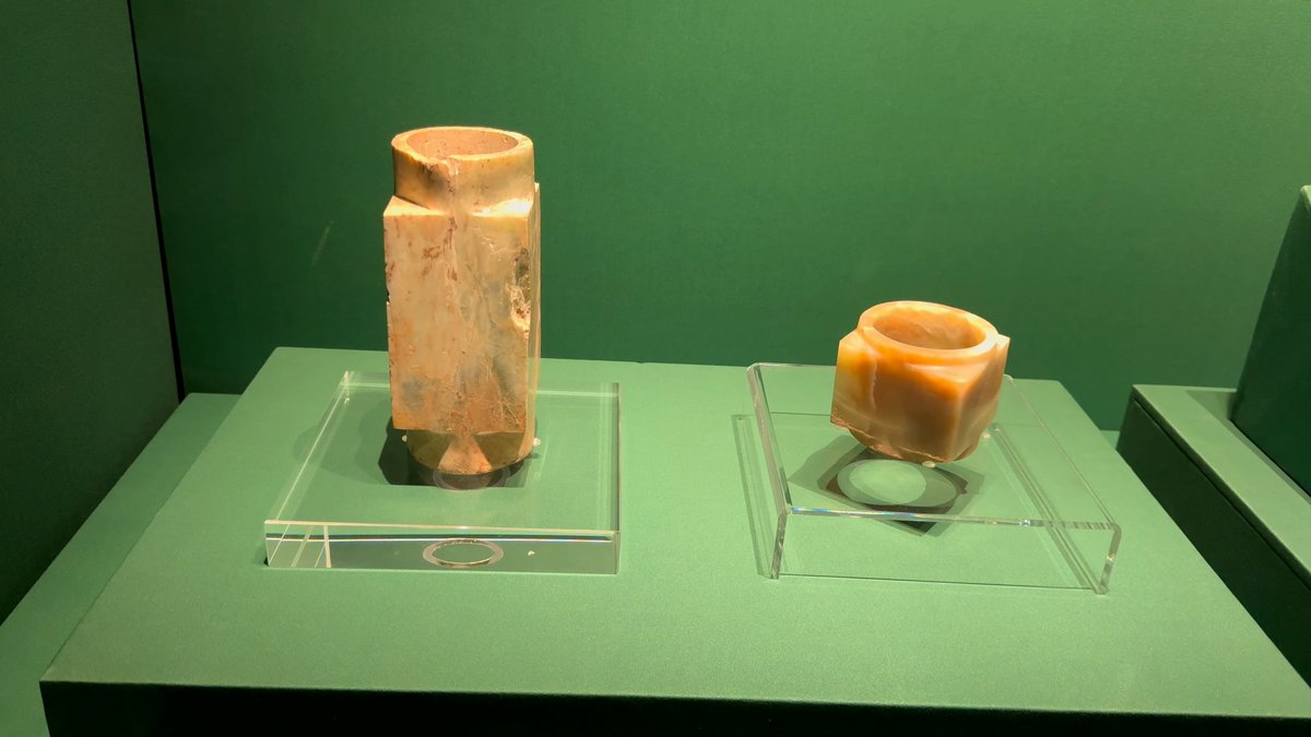 A pale jade tube and a jade ring