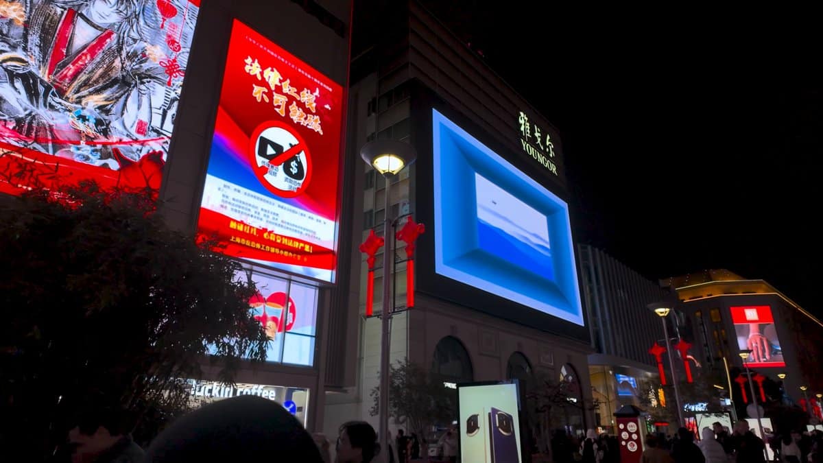 A red LED screen on a building corner