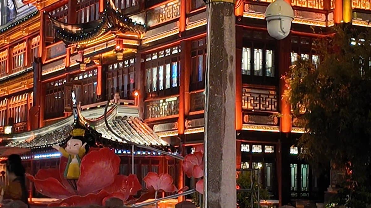 A red-lit building with a display of a