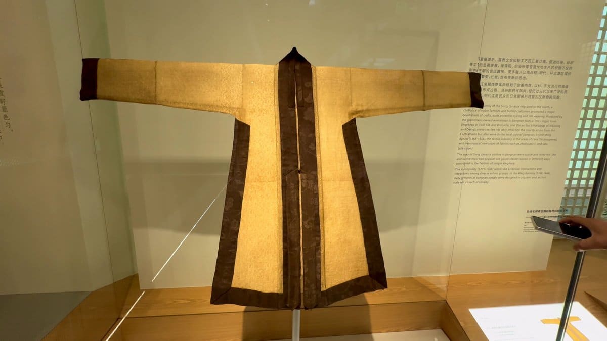 A robe with dark borders laid flat in