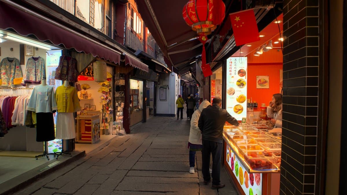 A shop of clothes and souvenirs under red