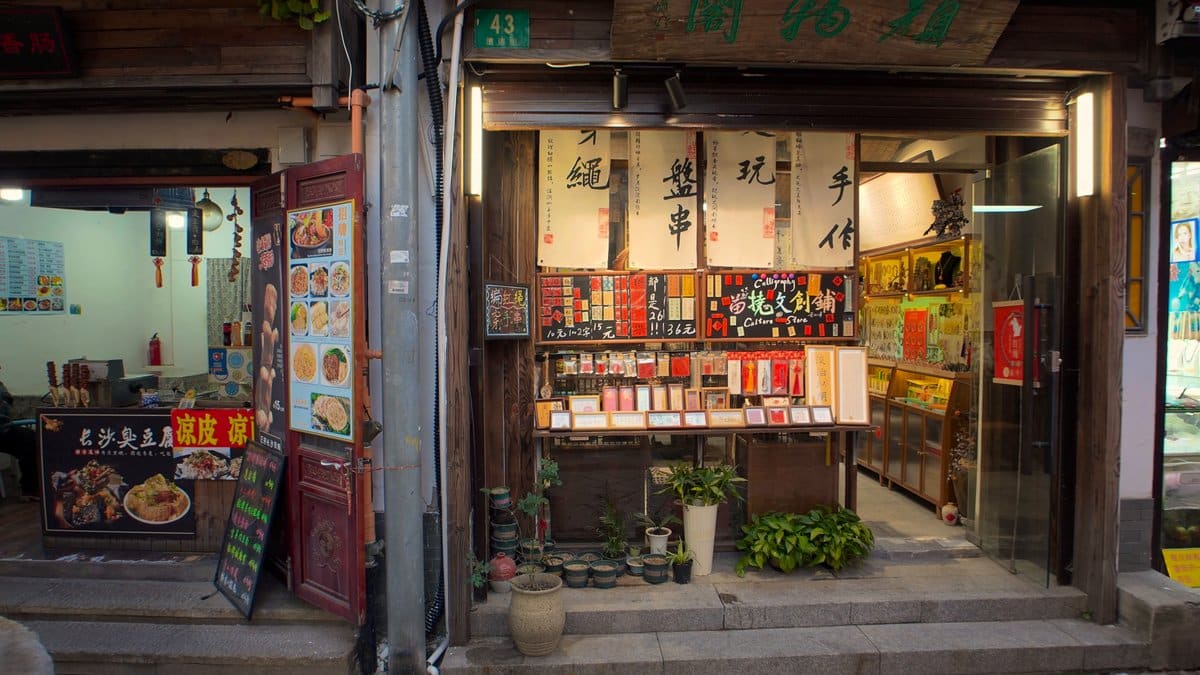 A shop of traditional goods lit warmly, a