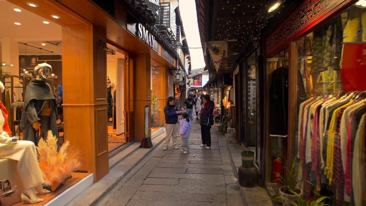 A shop window of crystal ornaments glowing orange,