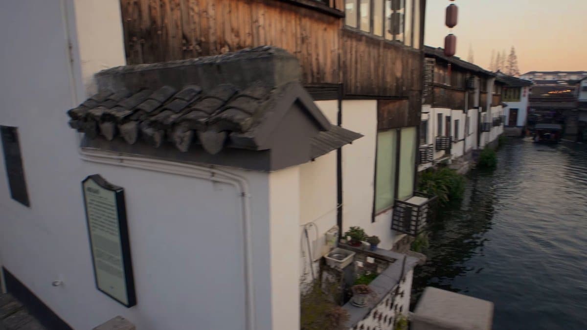 A small tiled roof on a white wall