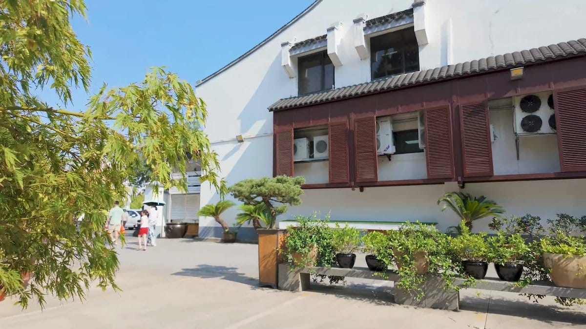 A white building with a timber gallery above