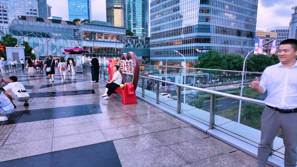 A wide section of the bridge deck, people