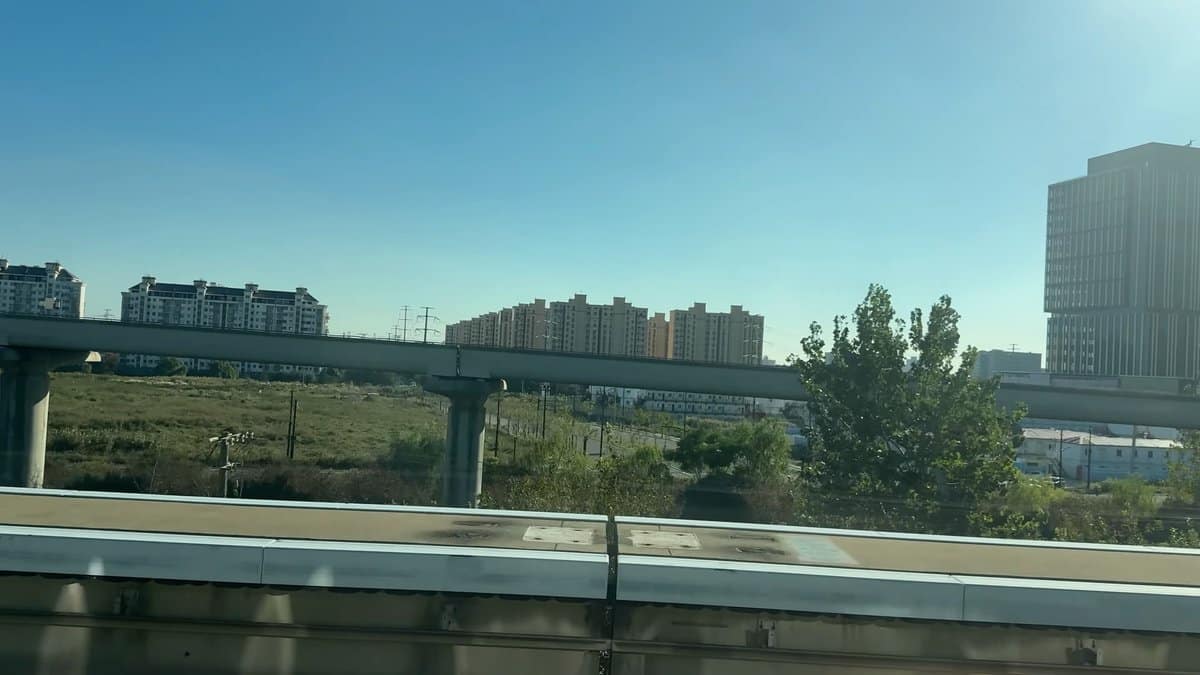 Apartment blocks flashing past Maglev