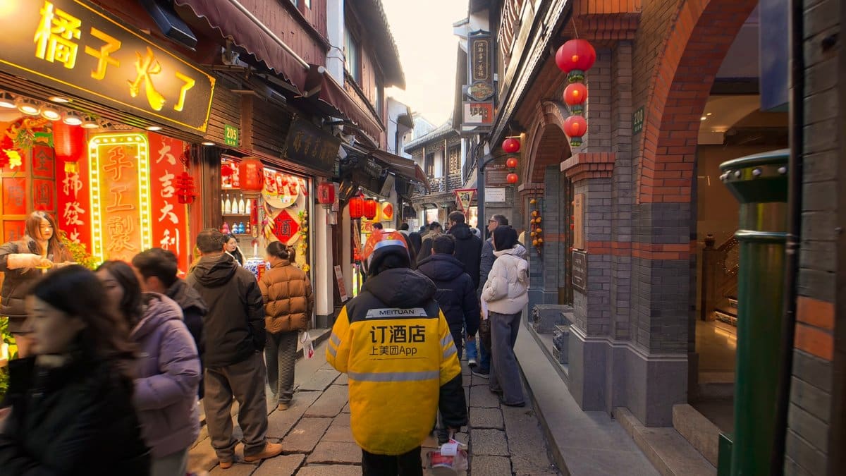 Busy lane hung with lanterns