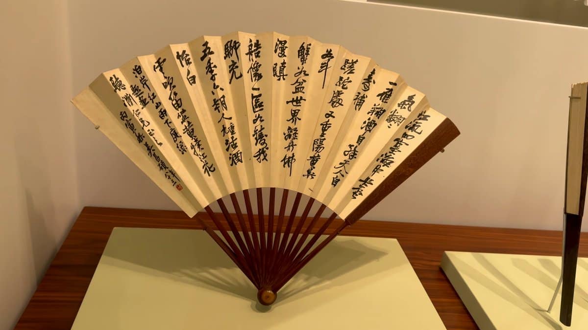 Calligraphy folding fan on stand