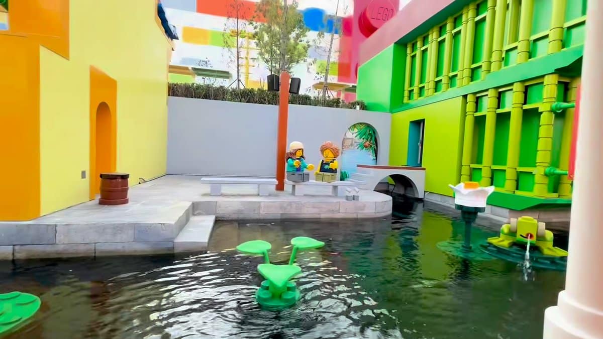 Colourful buildings and green frog