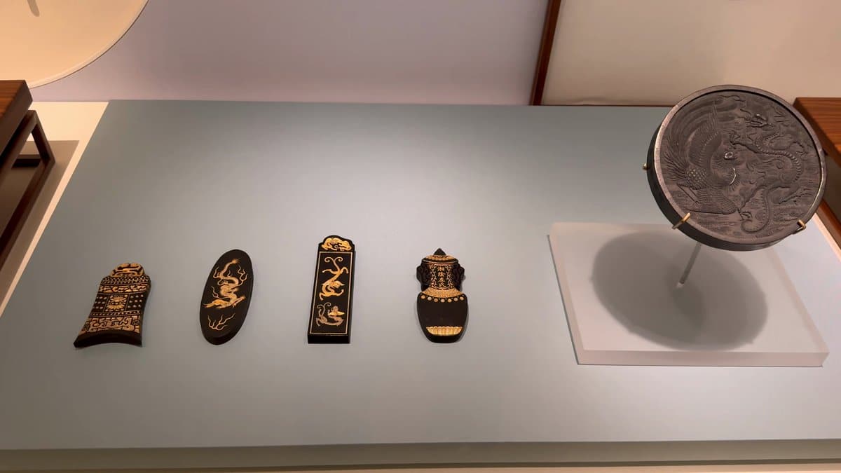 Decorated ink cakes set in a row beside