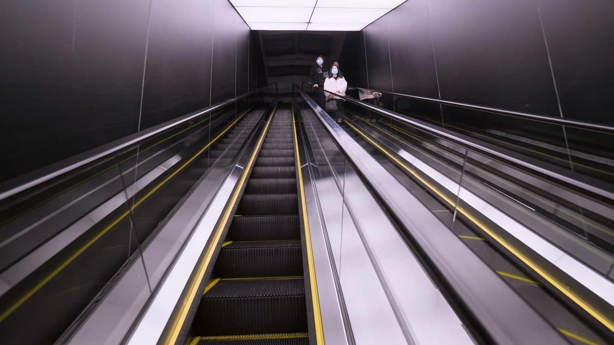 Escalator rising through a light shaft
