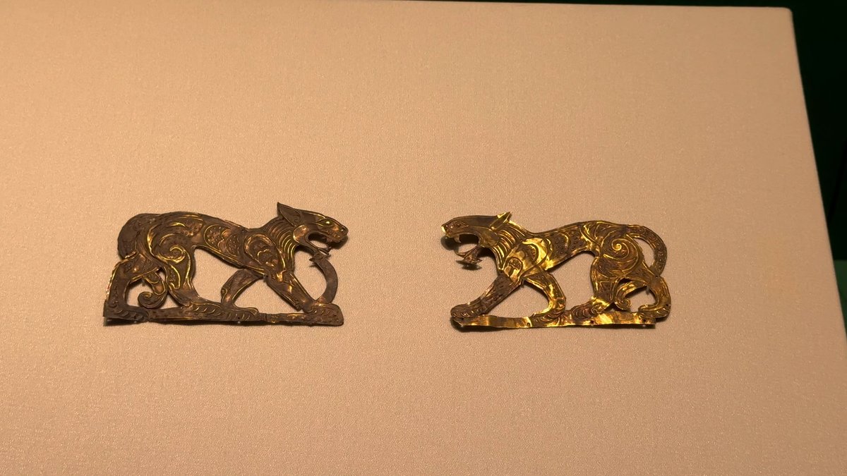 Gilt plaques of prowling tigers