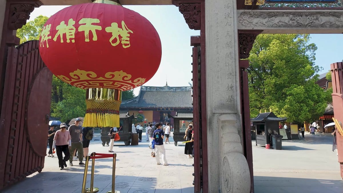 Gold-lettered lantern in temple gateway