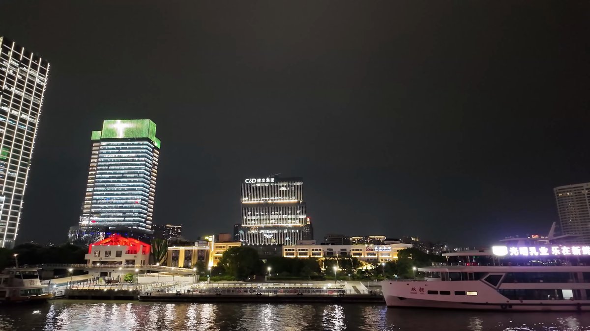 Green-lit tower along the bank