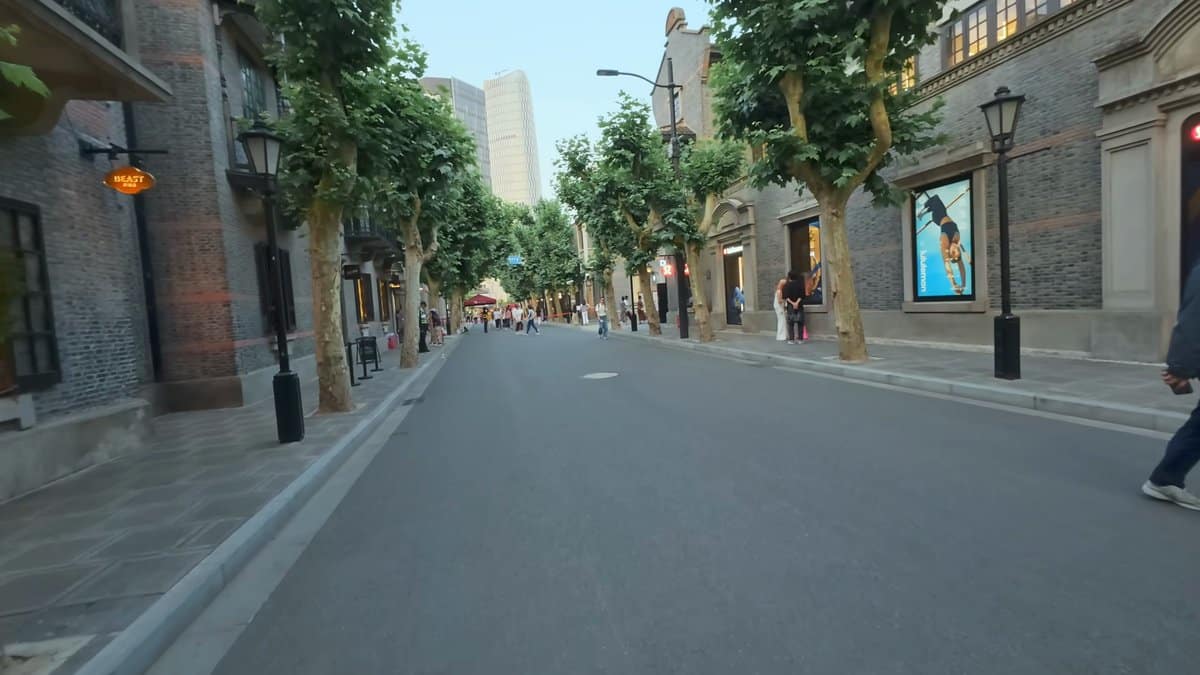 Grey-brick shikumen lane at dusk