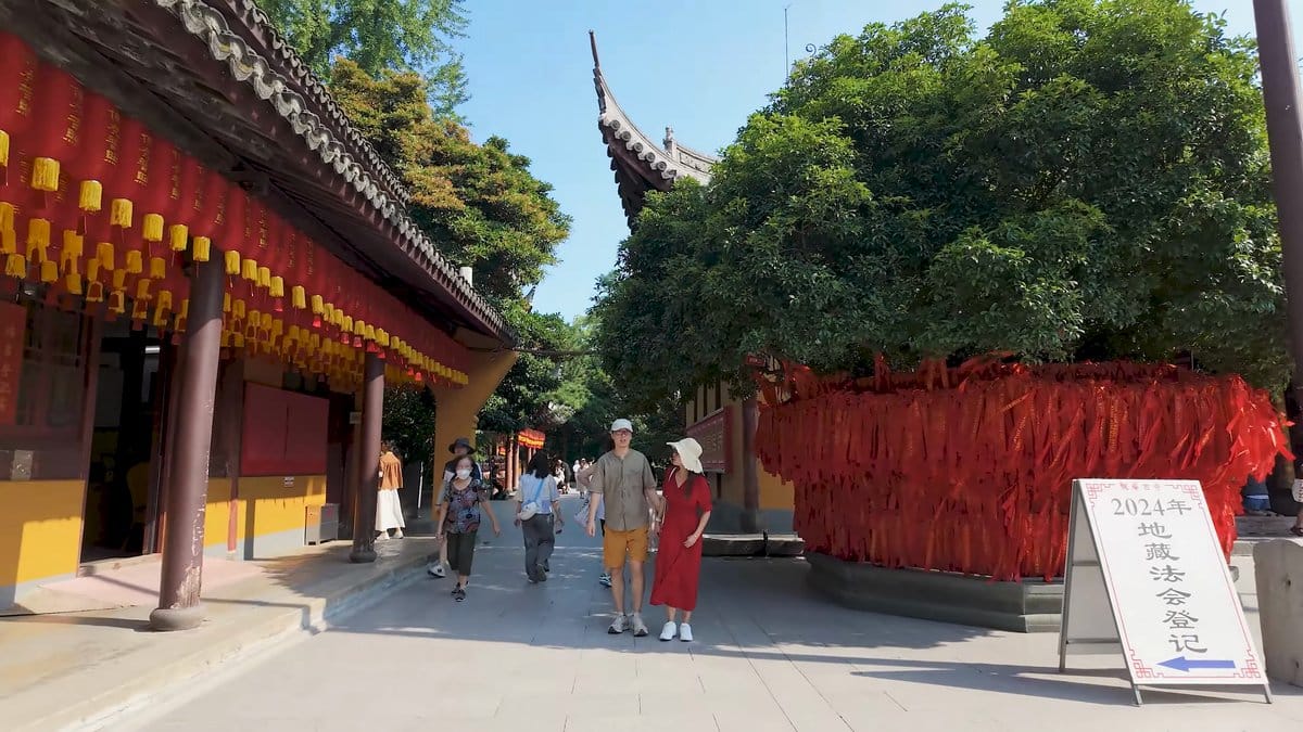 Halls hung with red ribbons, visitors reading a