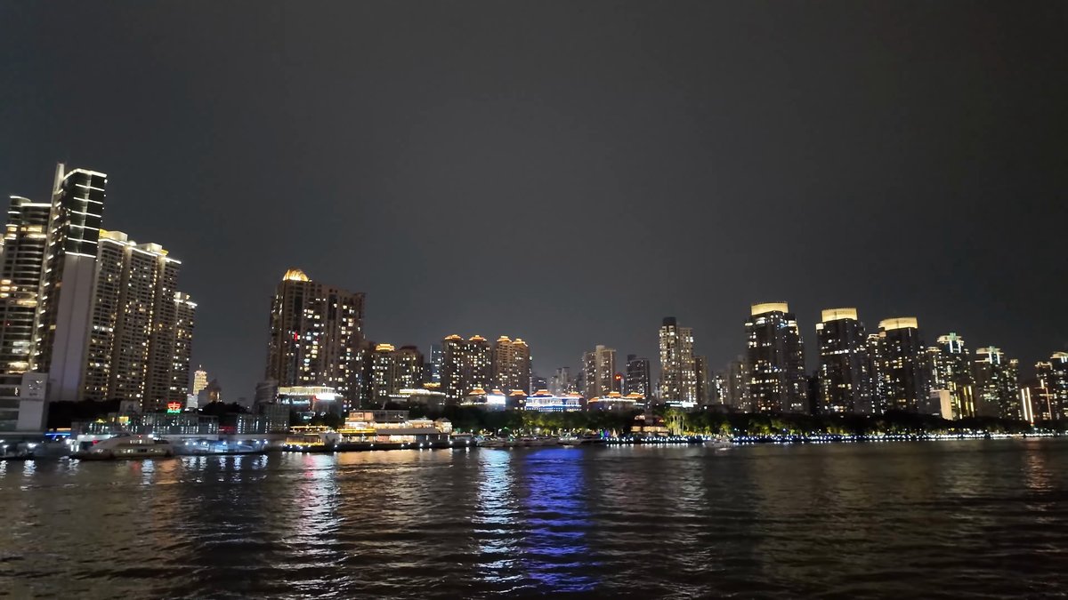 Lit apartments reflected on the water