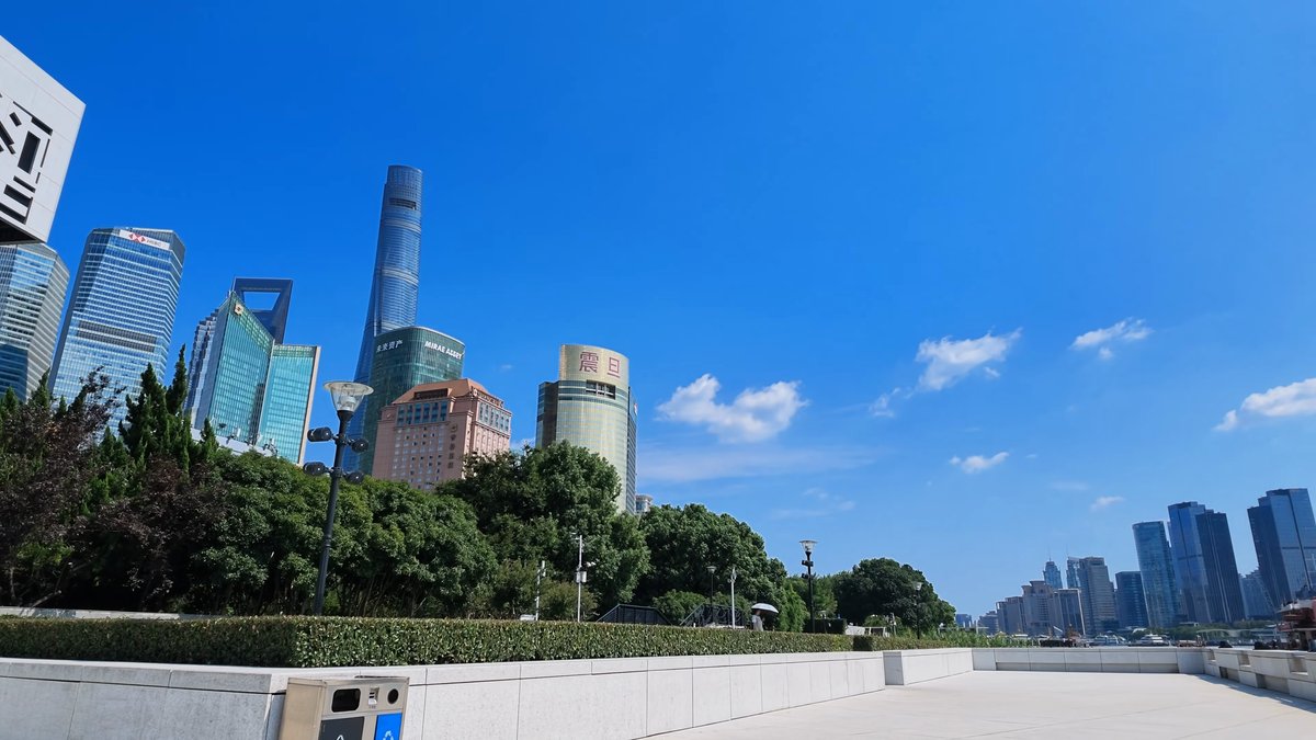 Lujiazui towers behind riverside park