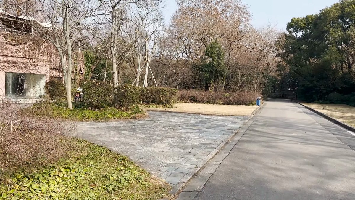 Open lawn along a zoo path