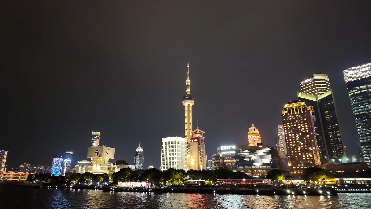Oriental Pearl glowing gold at night