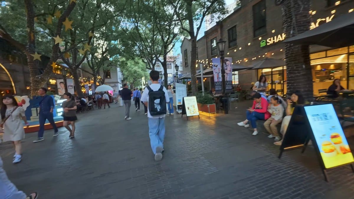 Outdoor cafe tables under lights