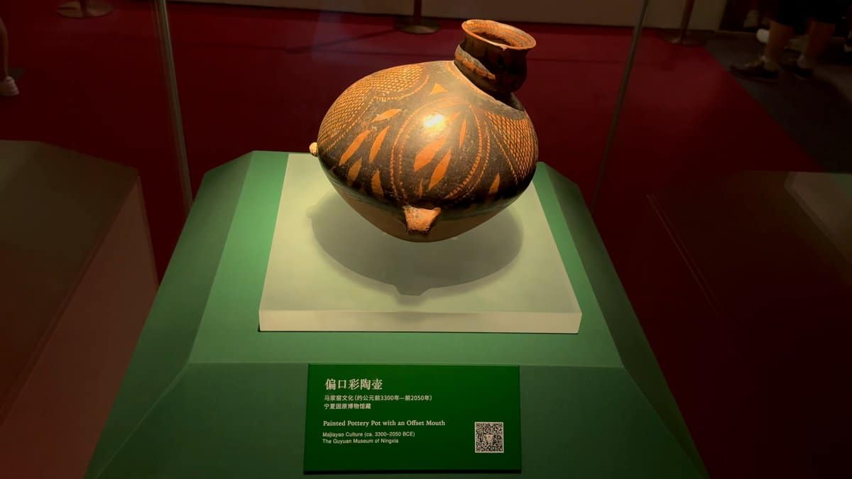 Painted pottery pot on plinth