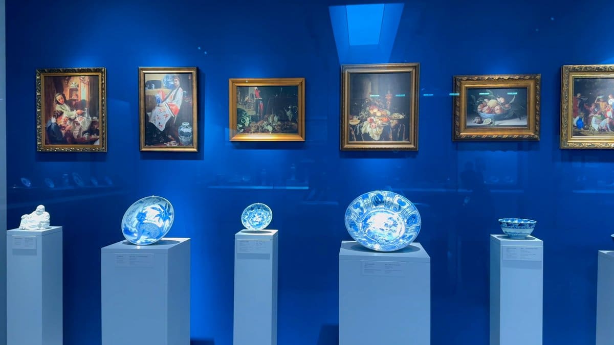 Paintings above blue-and-white porcelain