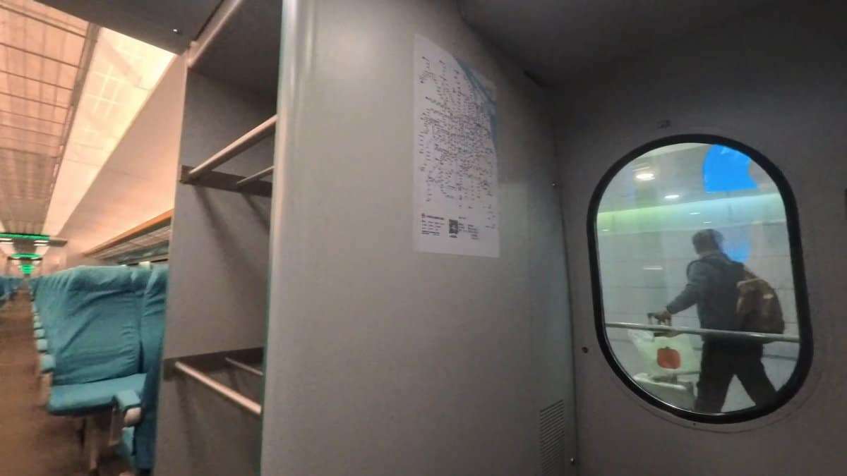 Passenger passing Maglev carriage door
