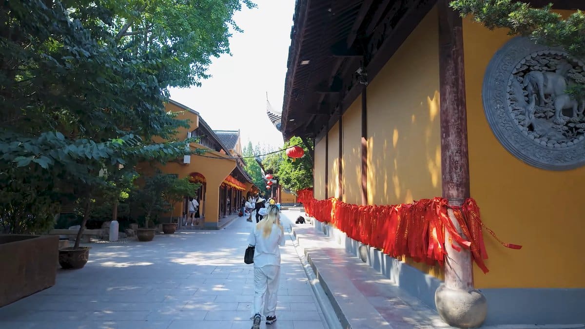 Prayer ribbons along the yellow wall