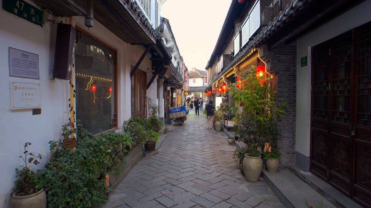 Quiet dusk lane with lanterns