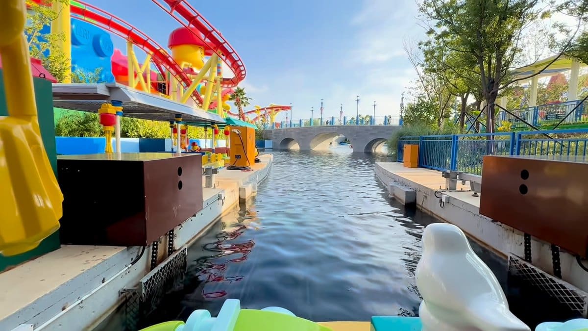 Roller coaster looping above canal