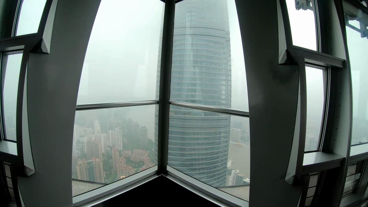 Shanghai Tower framed by windows