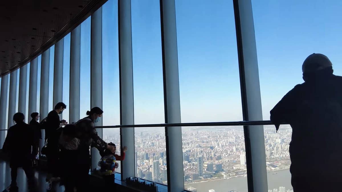 Silhouettes against the city windows