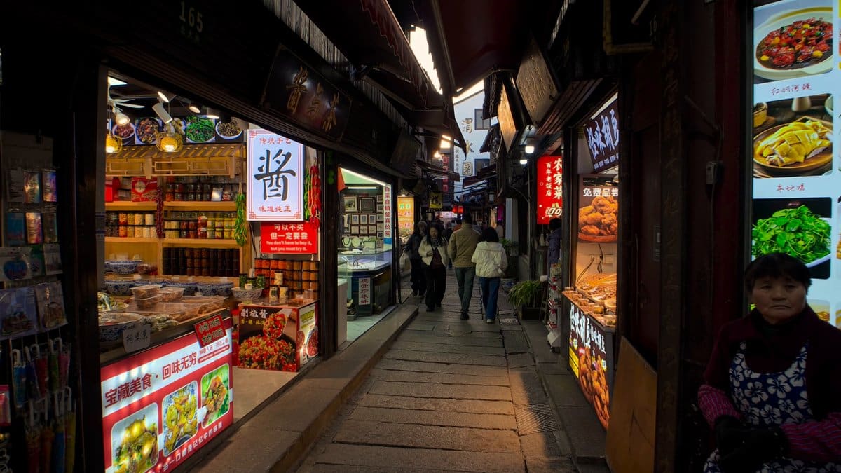 Snack shops glowing under eaves