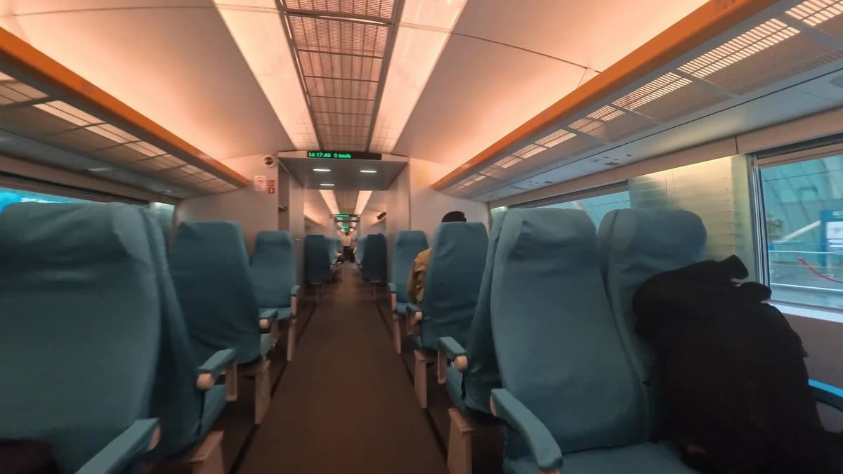 Teal seats inside the Maglev carriage