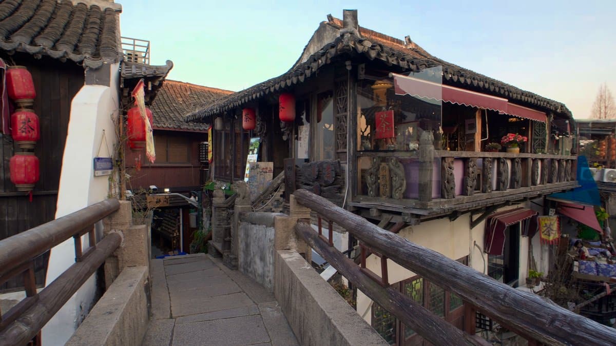 The bridge's timber railing with the waterside houses