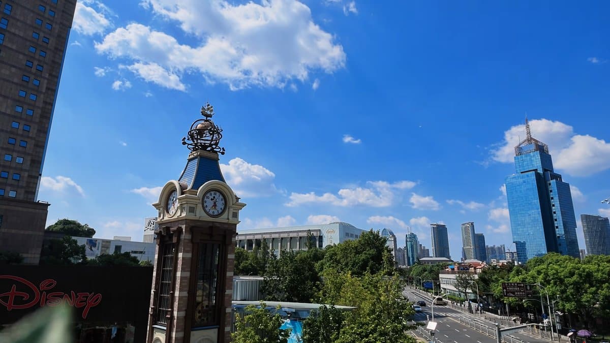 The clock tower with the Disney store behind