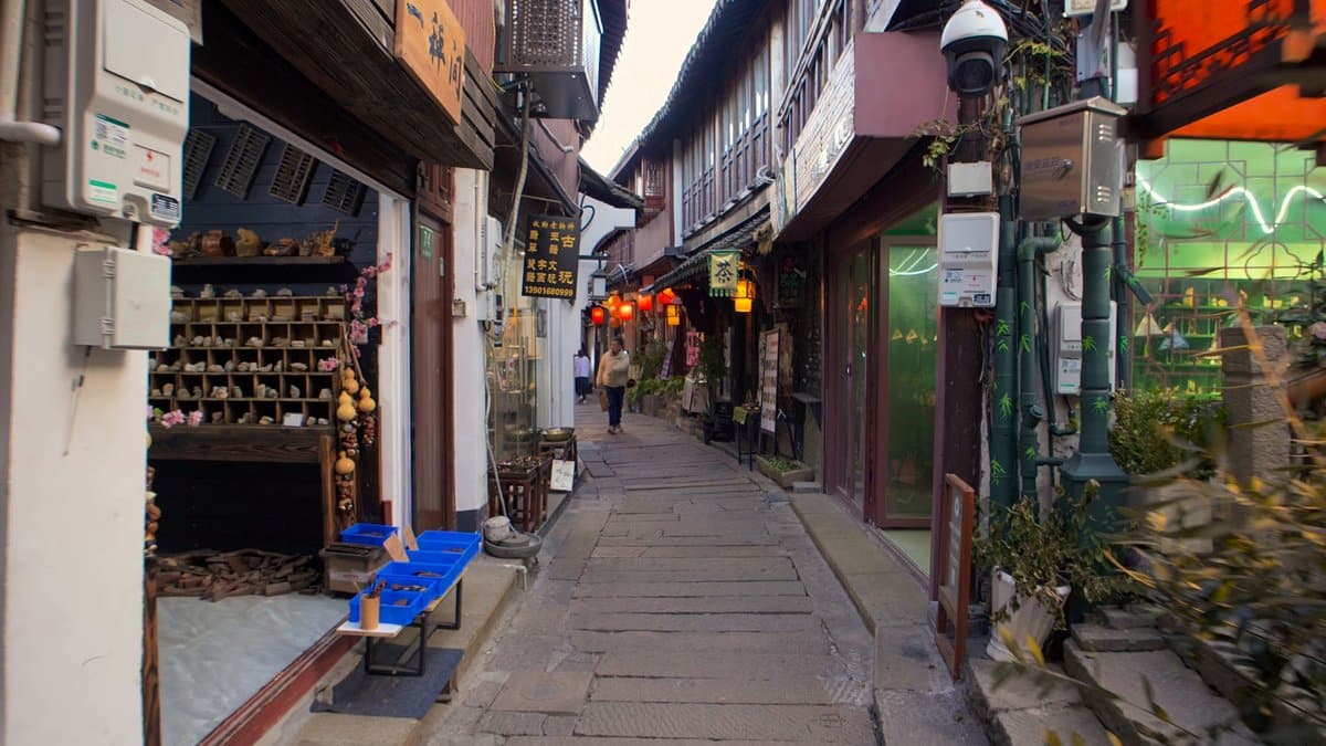The lane past a shop with a blue