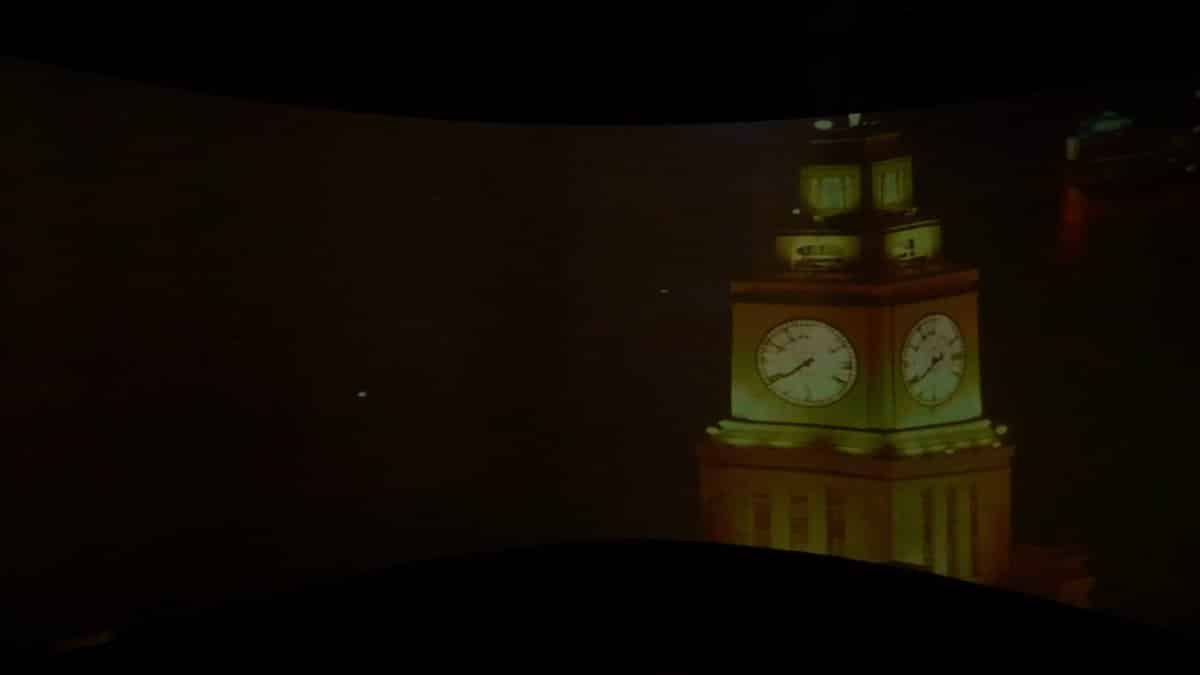 The projection moving on to a clock tower