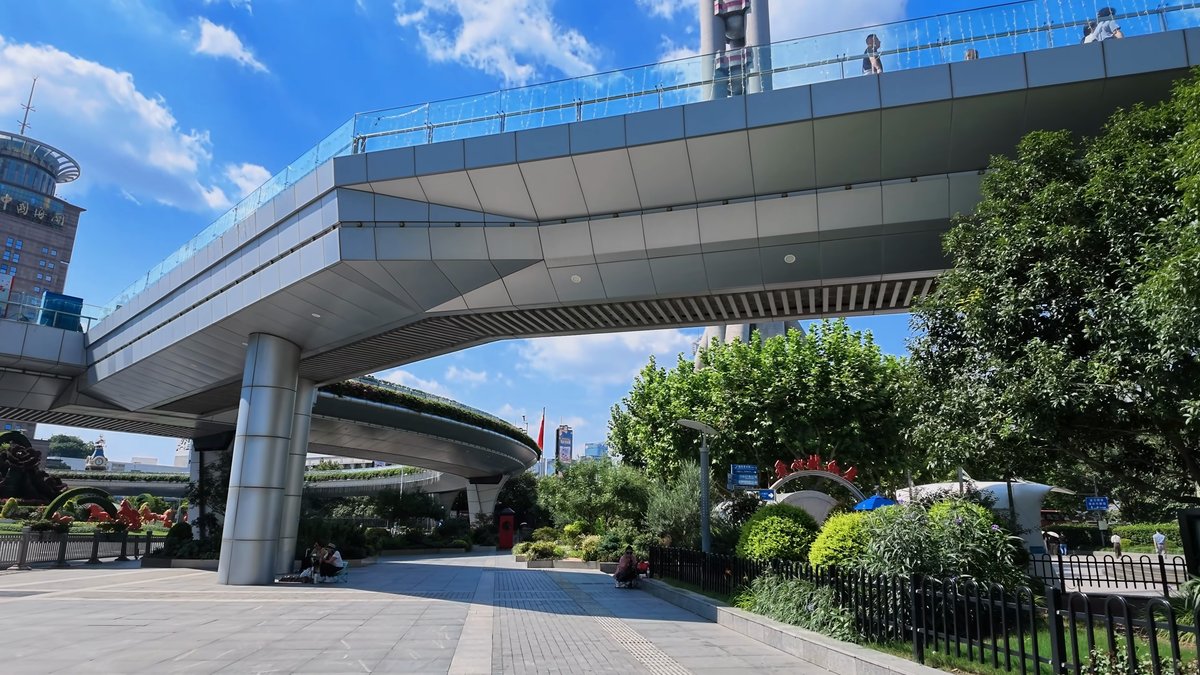 The skywalk's curving underside over the planting and